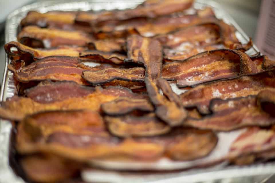How long can cooked bacon sit out